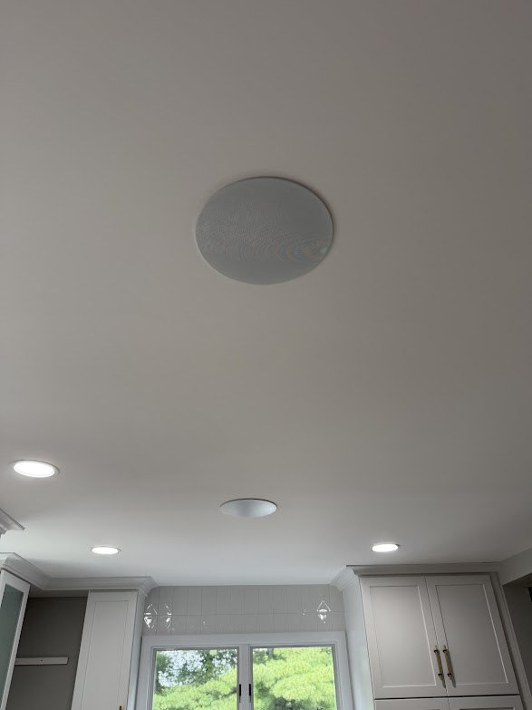 In-ceiling speaker installed in a modern kitchen